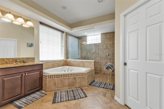 full bathroom with tile patterned floors, a walk in shower, vanity, and a bath