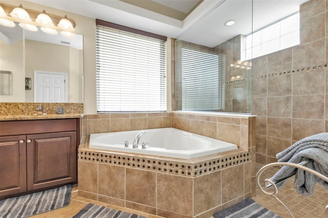 full bath with visible vents, tile patterned floors, a garden tub, vanity, and a walk in shower