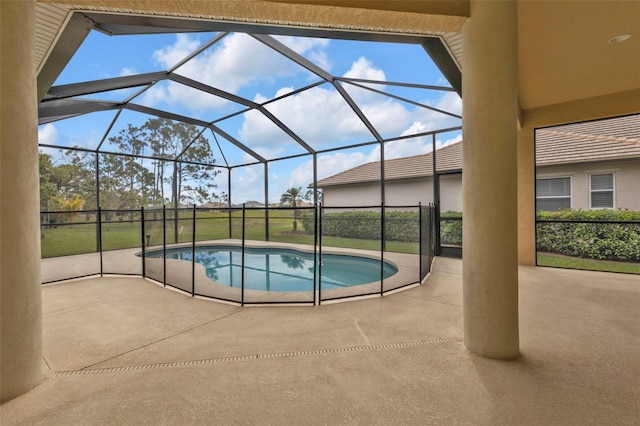 pool with a lanai and a patio area