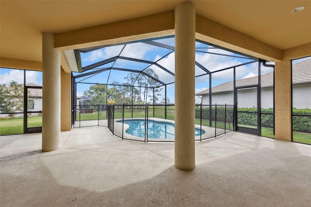 view of swimming pool featuring a fenced in pool, glass enclosure, and a patio