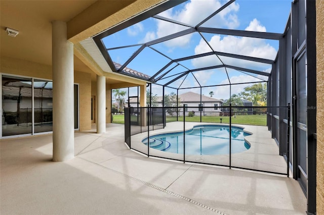 pool featuring a lanai and a patio area