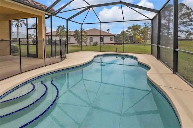 pool with a patio, a lawn, and a lanai