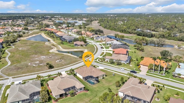 aerial view featuring a water view and a residential view