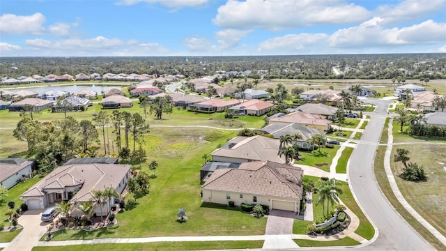 bird's eye view featuring a water view and a residential view