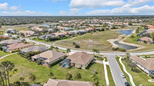 aerial view with a water view and a residential view