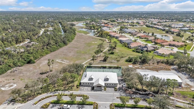 bird's eye view with a residential view and a water view