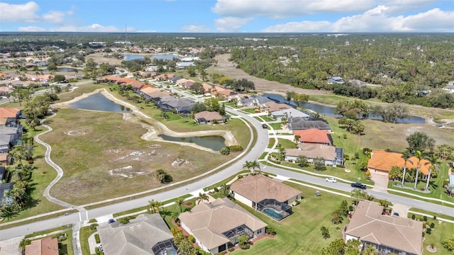 bird's eye view with a residential view and a water view