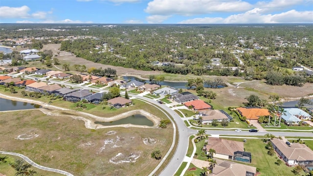 bird's eye view featuring a water view and a residential view