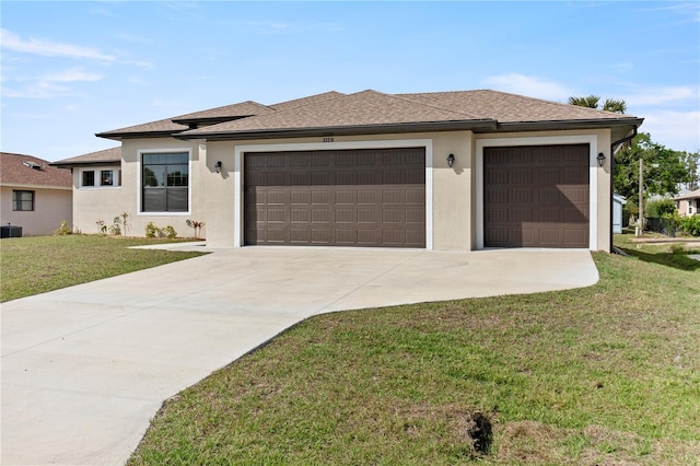 view of front facade with stucco siding, a shingled roof, a front yard, a garage, and driveway