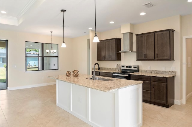 kitchen featuring visible vents, electric range, dark brown cabinetry, a sink, and wall chimney exhaust hood