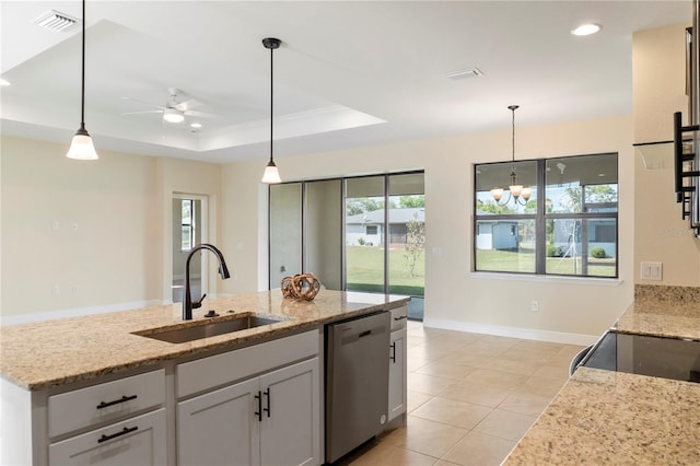 kitchen with recessed lighting, a raised ceiling, dishwasher, a sink, and ceiling fan with notable chandelier