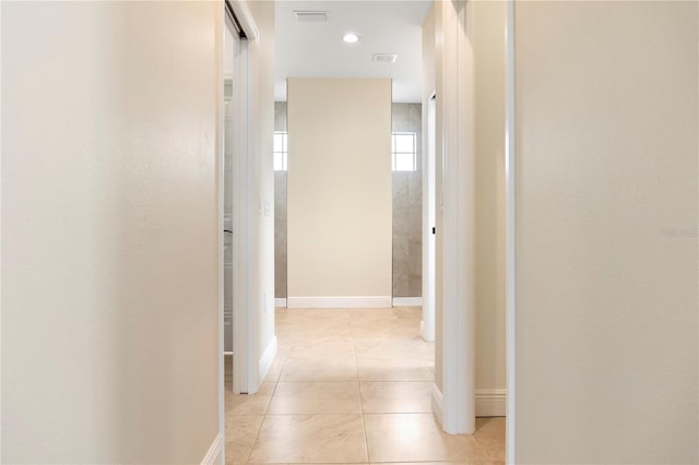 hallway featuring baseboards