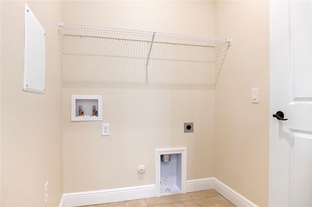 washroom with laundry area, hookup for a gas dryer, washer hookup, electric dryer hookup, and light tile patterned flooring