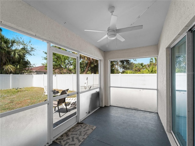 sunroom featuring a ceiling fan
