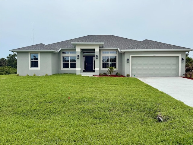 9171 Waldrep St, Port Charlotte, FL 33981 - prairie-style home with a garage, stucco siding, a front lawn, and driveway