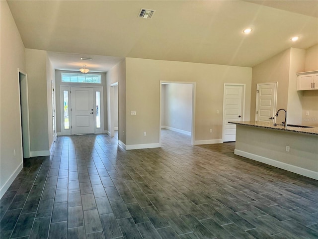 9590 Little Rock St, Port Charlotte, FL 33981 - entryway featuring dark wood-style floors and recessed lighting