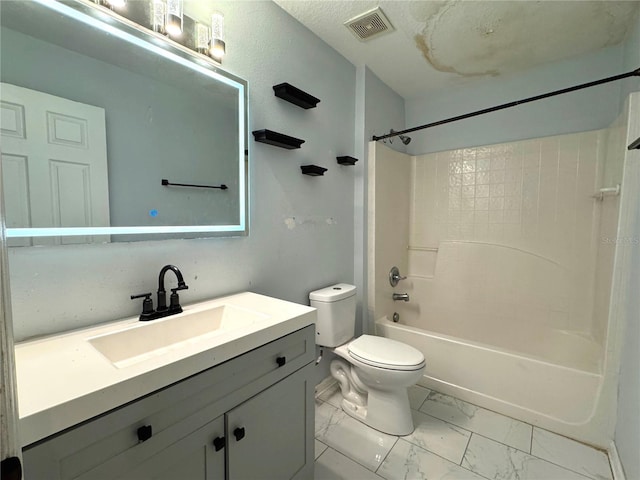 bathroom with shower / bathtub combination, toilet, vanity, visible vents, and marble finish floor