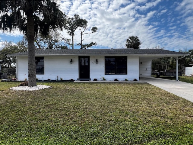 ranch-style house with driveway, a front lawn, and a carport