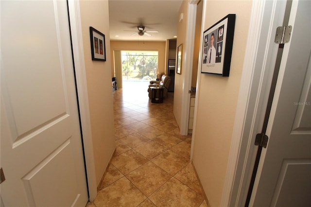 corridor with light tile patterned floors