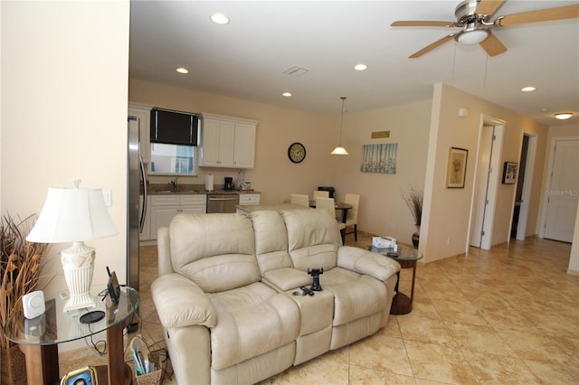 living room with light tile patterned flooring, visible vents, a ceiling fan, and recessed lighting