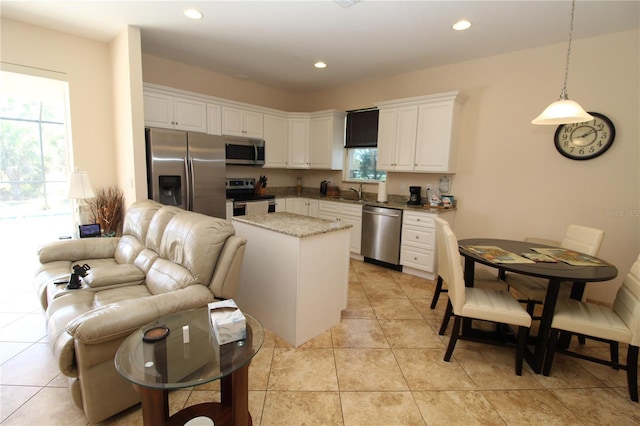 kitchen featuring pendant lighting, appliances with stainless steel finishes, recessed lighting, and white cabinets