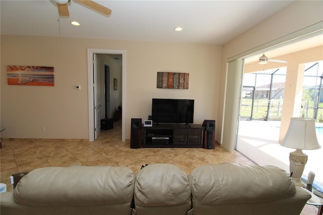 living room featuring a ceiling fan and recessed lighting