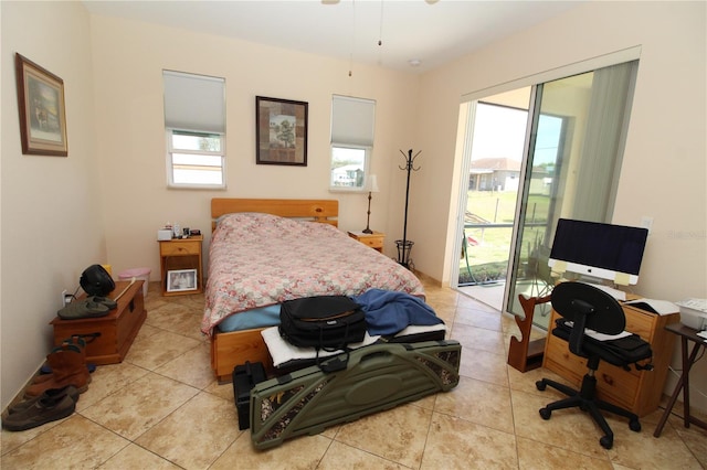 bedroom with access to exterior and light tile patterned flooring