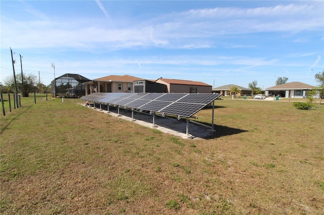 exterior space with ground mounted solar panels