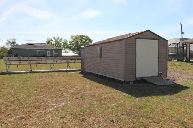 view of shed featuring fence