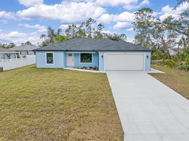 ranch-style house featuring a front yard, concrete driveway, and fence