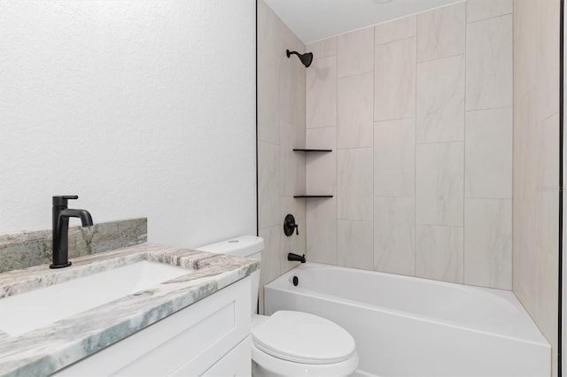 bathroom with shower / washtub combination, vanity, and toilet