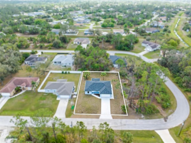 birds eye view of property with a residential view