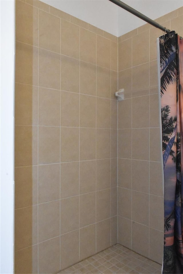 full bath featuring tiled shower