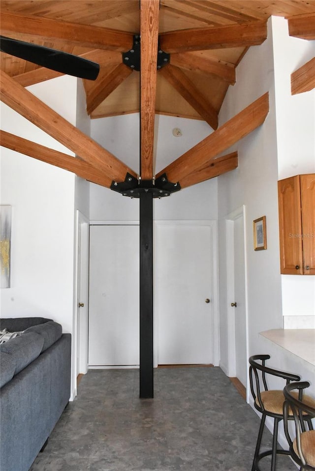 interior space featuring high vaulted ceiling and beamed ceiling