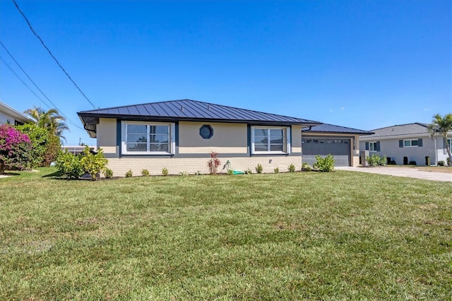 view of front of property with a front yard, a standing seam roof, brick siding, and driveway