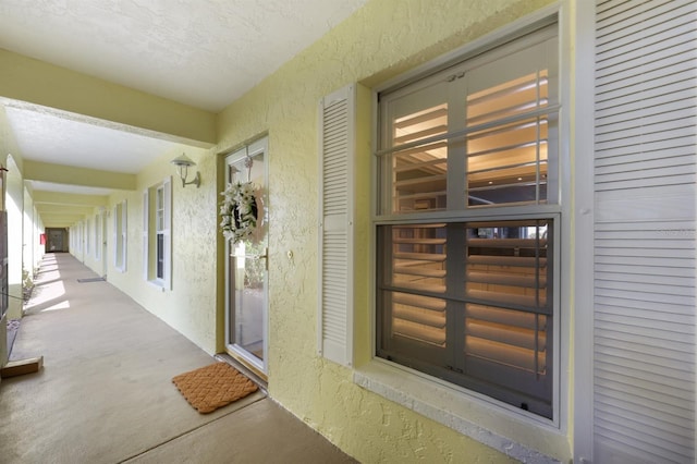 entrance to property featuring stucco siding