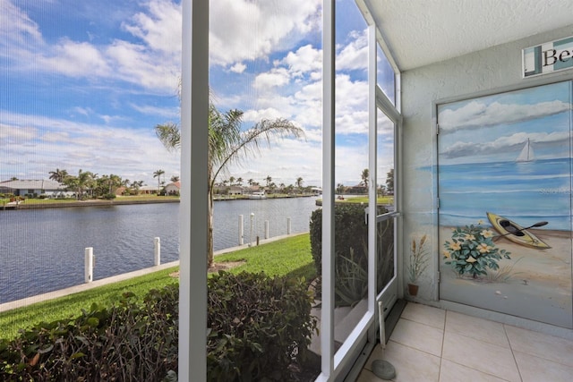 sunroom with a water view