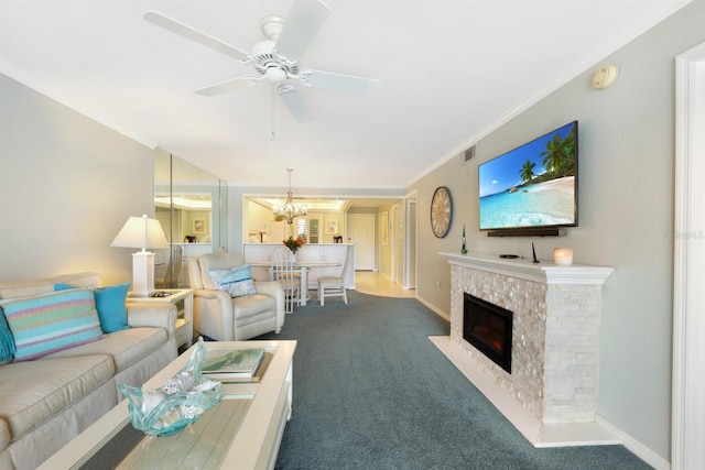 living area featuring visible vents, dark carpet, a fireplace with flush hearth, and ornamental molding