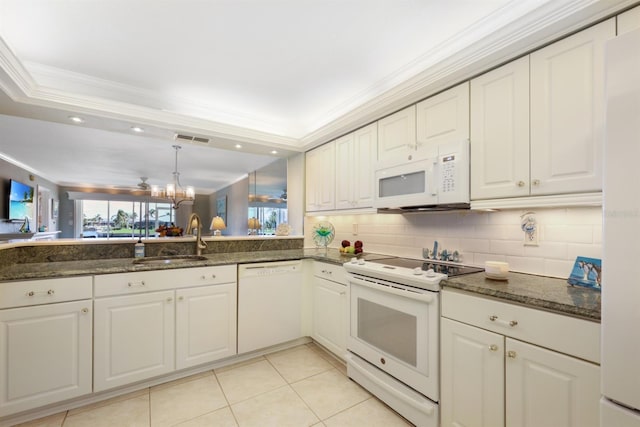 kitchen with crown molding, visible vents, white cabinets, a sink, and white appliances