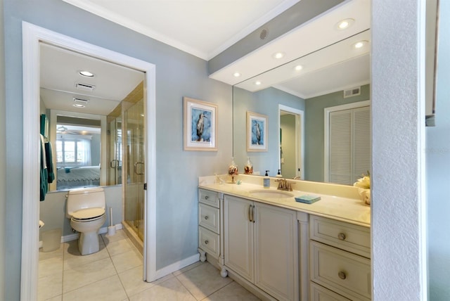 bathroom featuring tile patterned flooring, toilet, visible vents, vanity, and ornamental molding