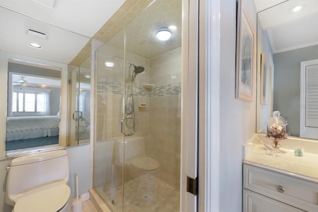 full bathroom with toilet, visible vents, vanity, a stall shower, and ensuite bath