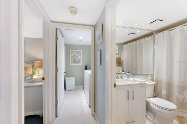 bathroom with baseboards, visible vents, toilet, tile patterned floors, and vanity