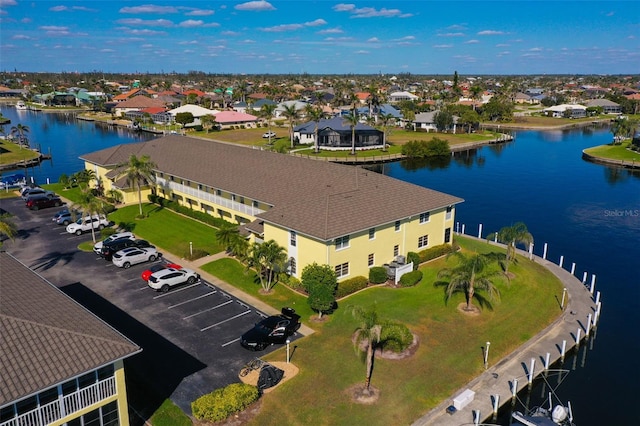 aerial view featuring a water view and a residential view