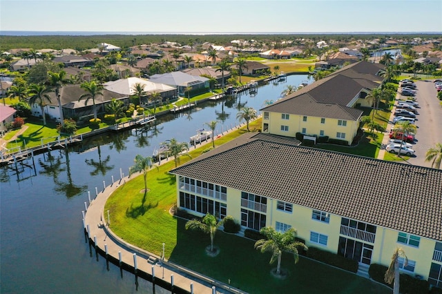 aerial view featuring a residential view and a water view