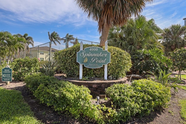 community sign featuring fence