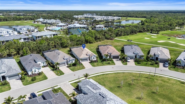 aerial view featuring view of golf course, a water view, and a residential view