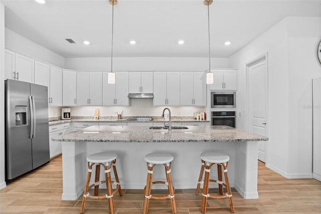 14724 Cherry Blossom Way, Punta Gorda, FL 33955 - kitchen featuring stainless steel appliances, a sink, visible vents, and white cabinets