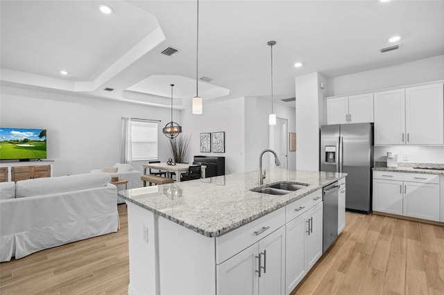 14724 Cherry Blossom Way, Punta Gorda, FL 33955 - kitchen with a tray ceiling, appliances with stainless steel finishes, a sink, and visible vents