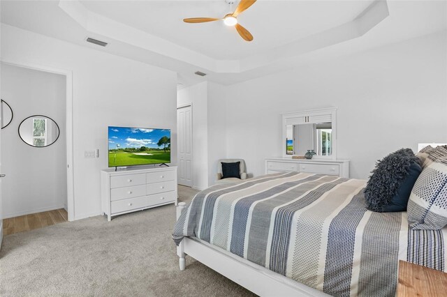 14724 Cherry Blossom Way, Punta Gorda, FL 33955 - bedroom featuring a ceiling fan, a tray ceiling, a closet, and visible vents