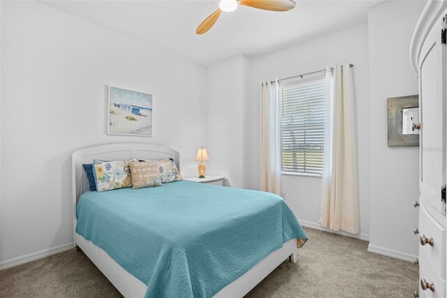 14724 Cherry Blossom Way, Punta Gorda, FL 33955 - bedroom with light carpet, ceiling fan, and baseboards